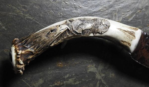 Close-Up of Eagle, Wolf and Buffalo Carved in Antler Knife Handle